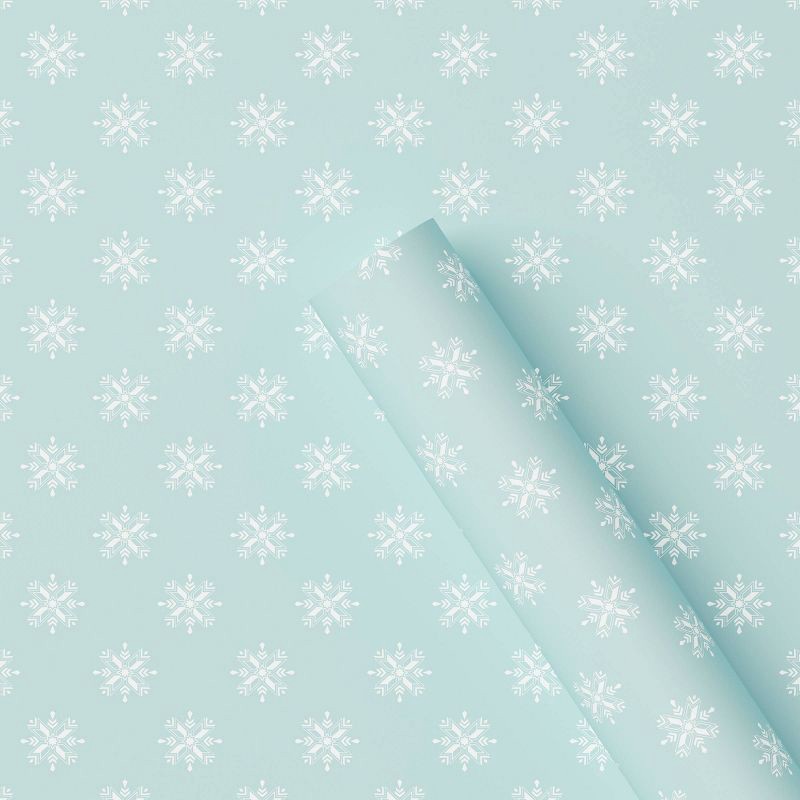 slide 1 of 3, 30" 20 sq ft Christmas Roll Wrap White Snowflakes on Light Blue - Wondershop™, 20 sq ft