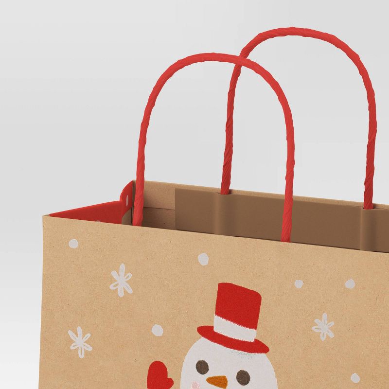 slide 3 of 4, 2ct Snowflake and Snowman Cub Christmas Gift Bags - Wondershop™, 2 ct