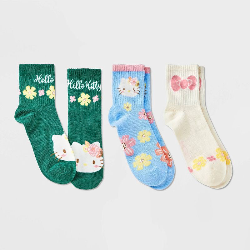 slide 1 of 3, Girls' Hello Kitty 3pk Mid Crew Socks - Blue Cream Green M/L, 3 ct