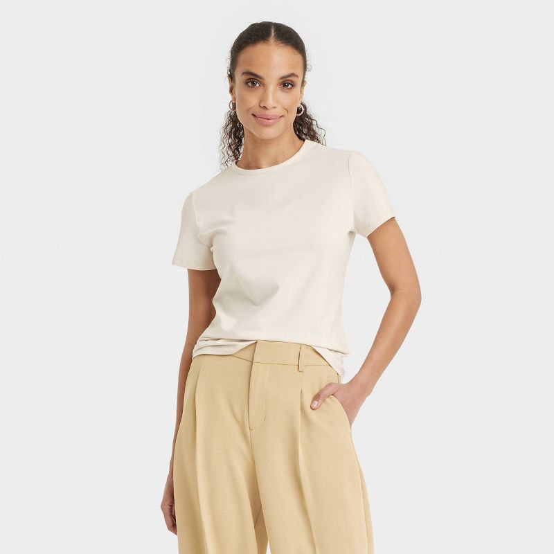 slide 1 of 4, Women's Short Sleeve T-Shirt - A New Day™ Cream S: Cotton Spandex Blend, Lightweight Jersey, Casual Pullover, 1 ct