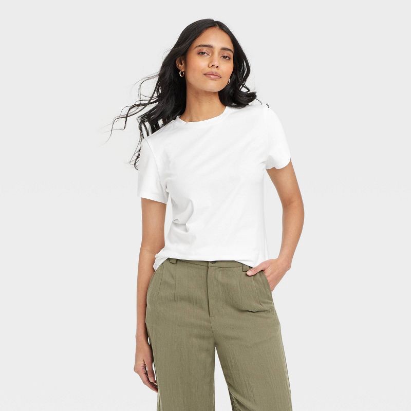 slide 1 of 4, Women's Short Sleeve T-Shirt - A New Day™ White M: Casual Fit, Crew Neck, Lightweight Cotton-Spandex Blend, Machine Washable, 1 ct