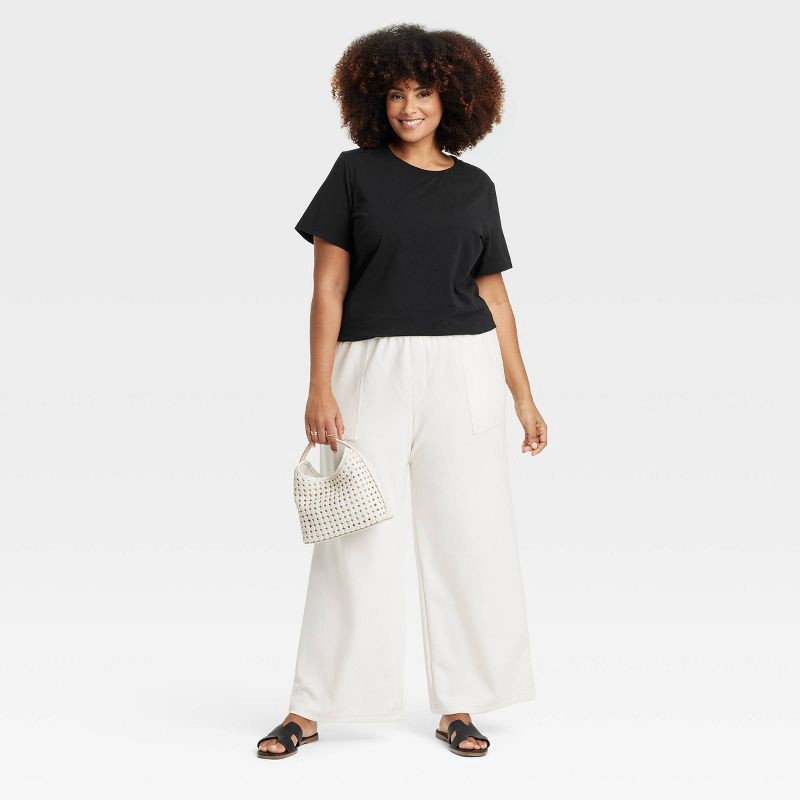 slide 3 of 4, Women's Short Sleeve T-Shirt - A New Day™ Dark Black XXL: Crew Neck, Lightweight Jersey, Pullover Style, 1 ct