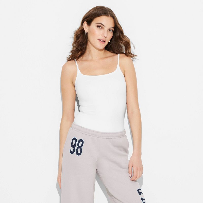 slide 2 of 5, Women's ButterBliss Bodysuit - Wild Fable™ White XS: Recycled Polyester, Spandex, Adjustable Strap, Crotch Snap, Scoop Back, 1 ct