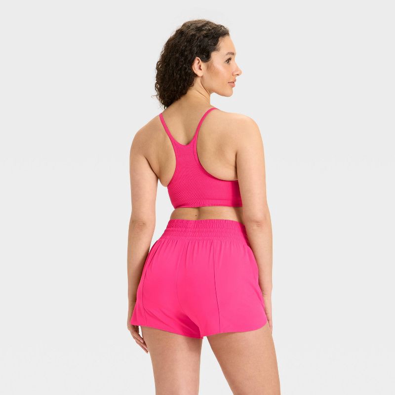 slide 2 of 3, Women's Seamless Ribbed Light Support Sports Bra - All In Motion™ Berry Pink L, 1 ct