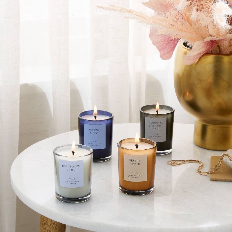 slide 2 of 3, 4pk Candle Gift Set Rainwater Lily + Marine Moss + Desert Amber + Charcoal Black Teak - Threshold™, 4 ct