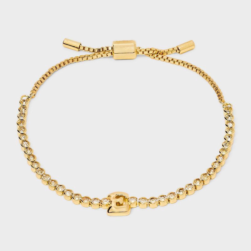 slide 1 of 4, SUGARFIX by BaubleBar Crystal Initial "E" Chain Bracelet - Gold: Brass Stretch Jewelry, Drawstring Closure, 8" Length, 1 ct