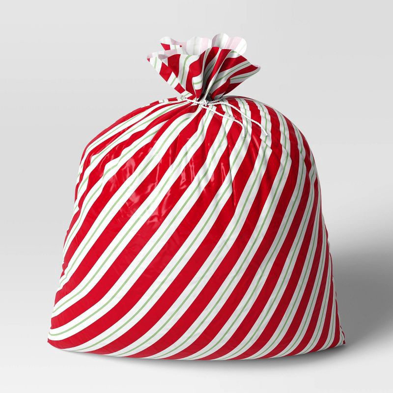 slide 1 of 3, 30"x 36" Red and Green Stripes Christmas Gift Sack - Wondershop™, 1 ct