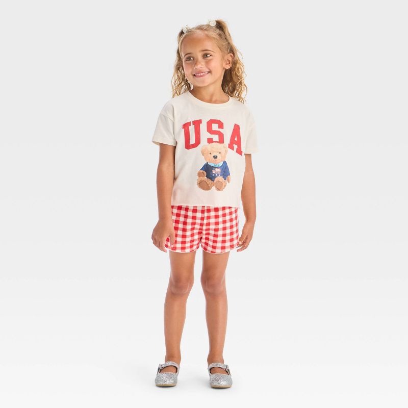 slide 1 of 4, Grayson Mini Toddler Girls' 2pc Americana USA Teddy Bear Short Sleeve T-Shirt and Gingham Shorts Set - Red 5T, 2 ct