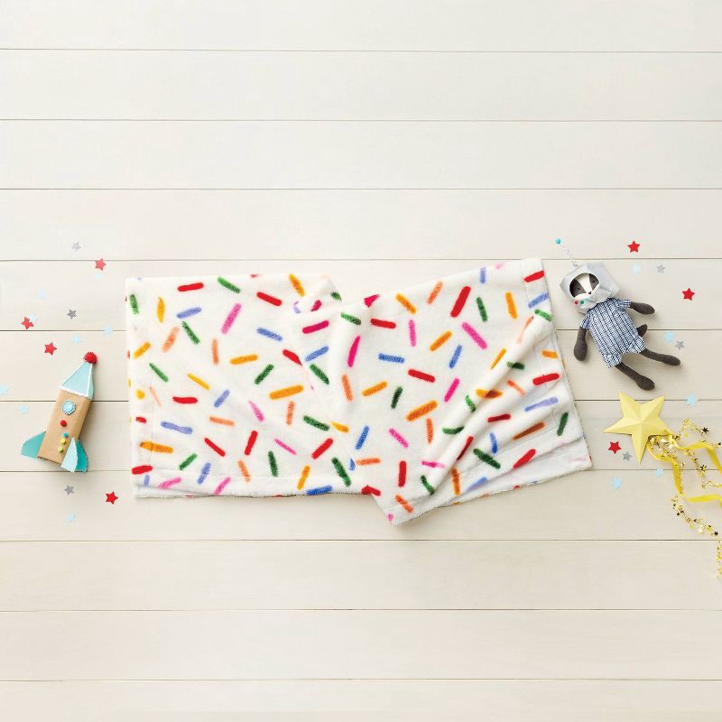 slide 2 of 3, 50"x60" Holiday Sprinkles Fuzzy Kids' Throw Blanket White - Pillowfort™, 1 ct
