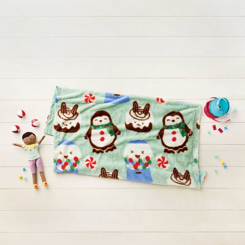 slide 2 of 3, 50"x60" Holiday Treats Fuzzy Kids' Throw Blanket Mint Green - Pillowfort™, 1 ct