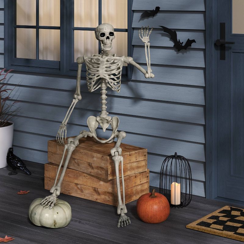 slide 2 of 3, 60" Poseable Bone Skeleton Halloween Decorative Prop Off-White - Hyde and EEK! Boutique™, 1 ct