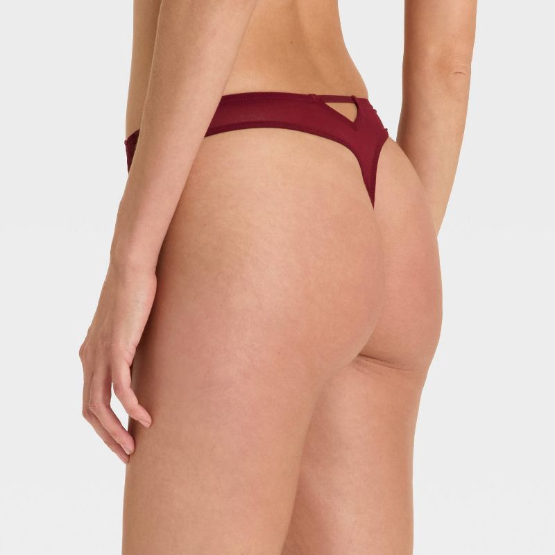 slide 2 of 5, Women's Lace Cut Out Thong Underwear - Auden™ Berry Red M, 1 ct