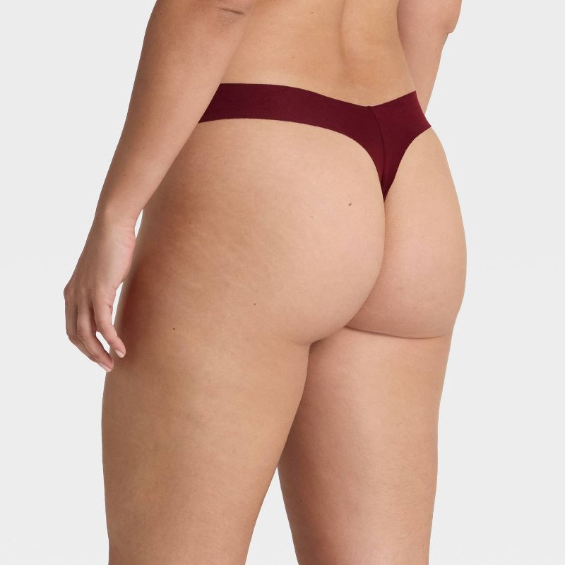 slide 2 of 5, Women's Invisible Edge Cotton Thong Underwear - Auden™ Berry Red M, 1 ct