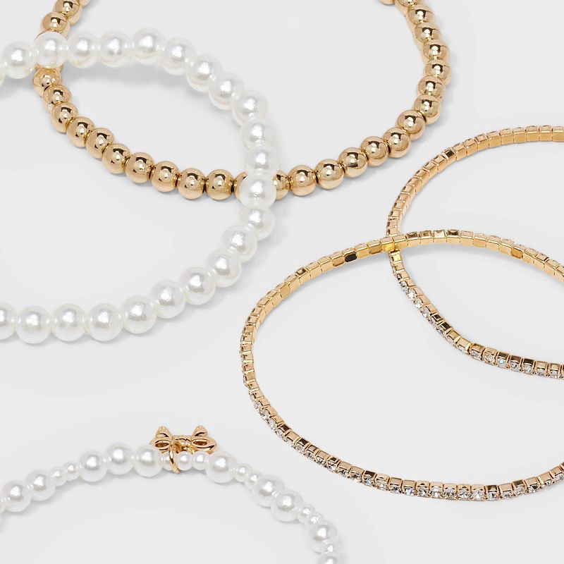 slide 4 of 4, Beaded and Pearl Bow Charm Bracelet Set 5pc - Wild Fable™ Gold, 5 ct