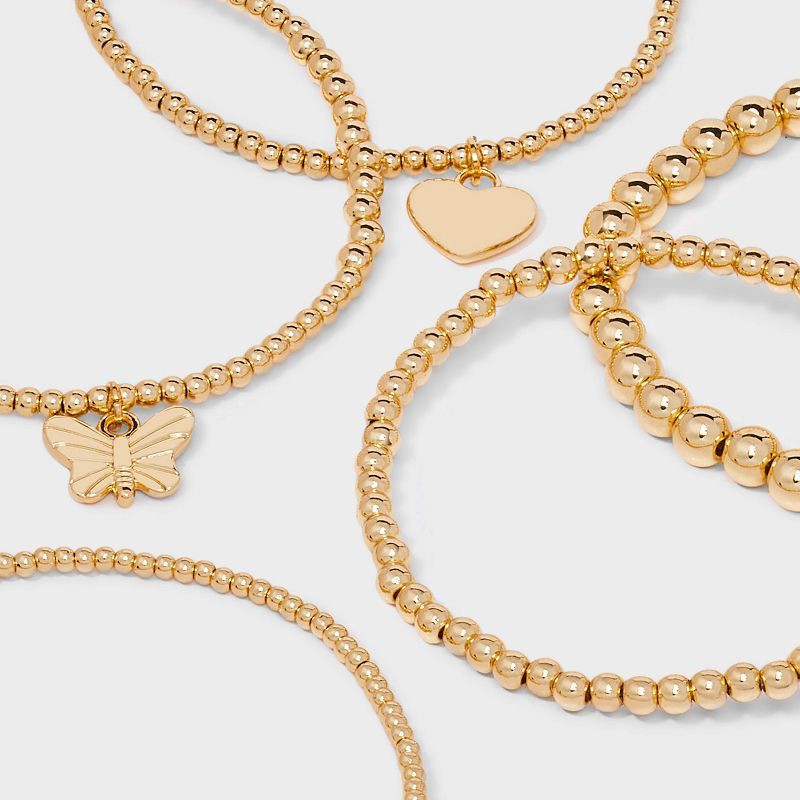 slide 4 of 4, Butterfly and Heart Charm Stretch Bracelet Set 5pc - Wild Fable™ Gold, 5 ct