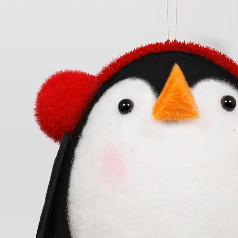 slide 3 of 3, Christmas Felted Wool Penguin Ornament with Earmuffs - Wondershop™, 1 ct