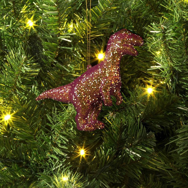 slide 2 of 3, 5" Christmas Plastic Chunky Glitter Pink Dinosaur Ornament - Wondershop™, 1 ct