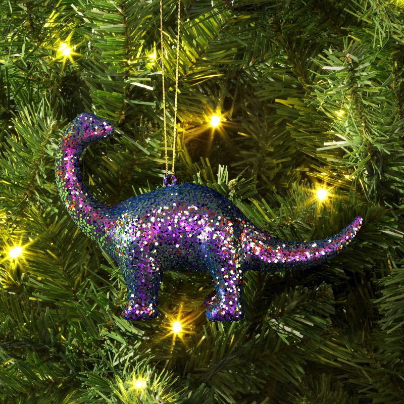 slide 2 of 3, 5" Christmas Plastic Chunky Glitter Dinosaur Ornament Purple - Wondershop™, 1 ct