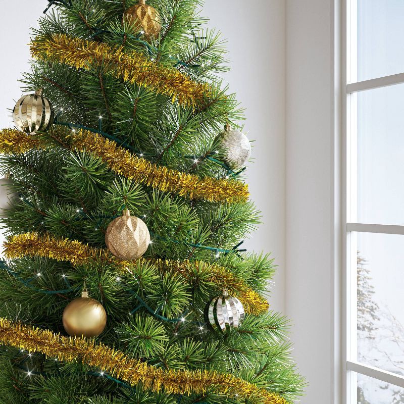 slide 2 of 3, 10' Christmas Soft and Silky Tinsel Garland Champagne Gold - Wondershop™, 1 ct