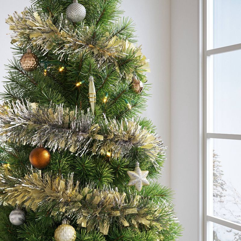 slide 2 of 3, 10' Christmas Tinsel Garland Mega Wide Cut Gold and Narrow Cut Silver - Wondershop™, 1 ct