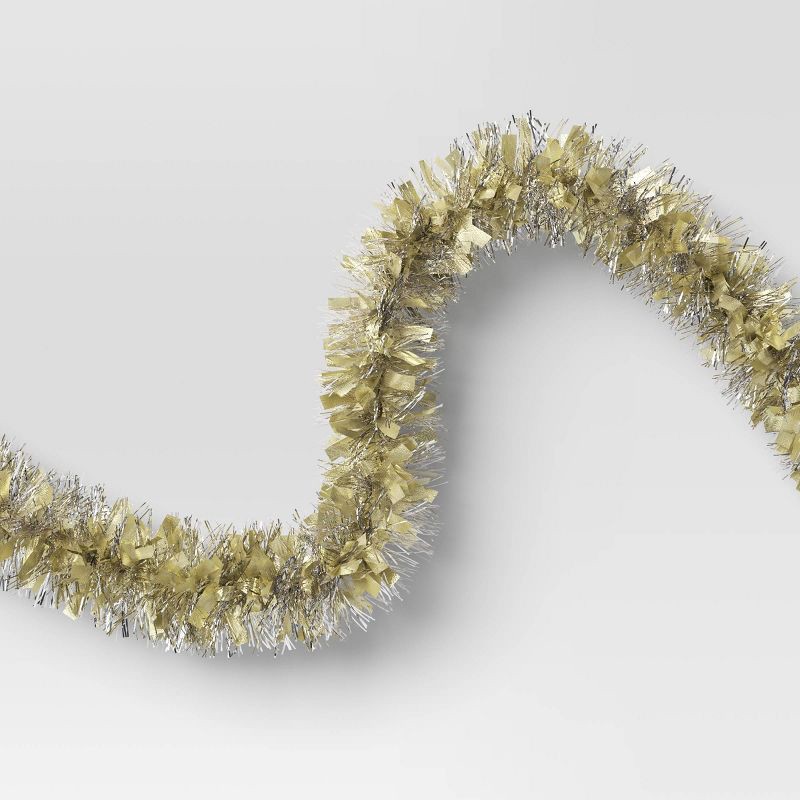 slide 3 of 3, 10' Christmas Tinsel Garland Mega Wide Cut Gold and Narrow Cut Silver - Wondershop™, 1 ct