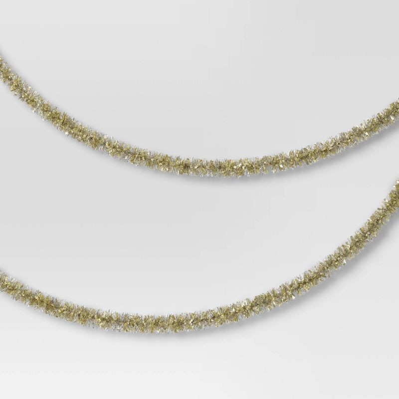 slide 1 of 3, 10' Christmas Tinsel Garland Mega Wide Cut Gold and Narrow Cut Silver - Wondershop™, 1 ct