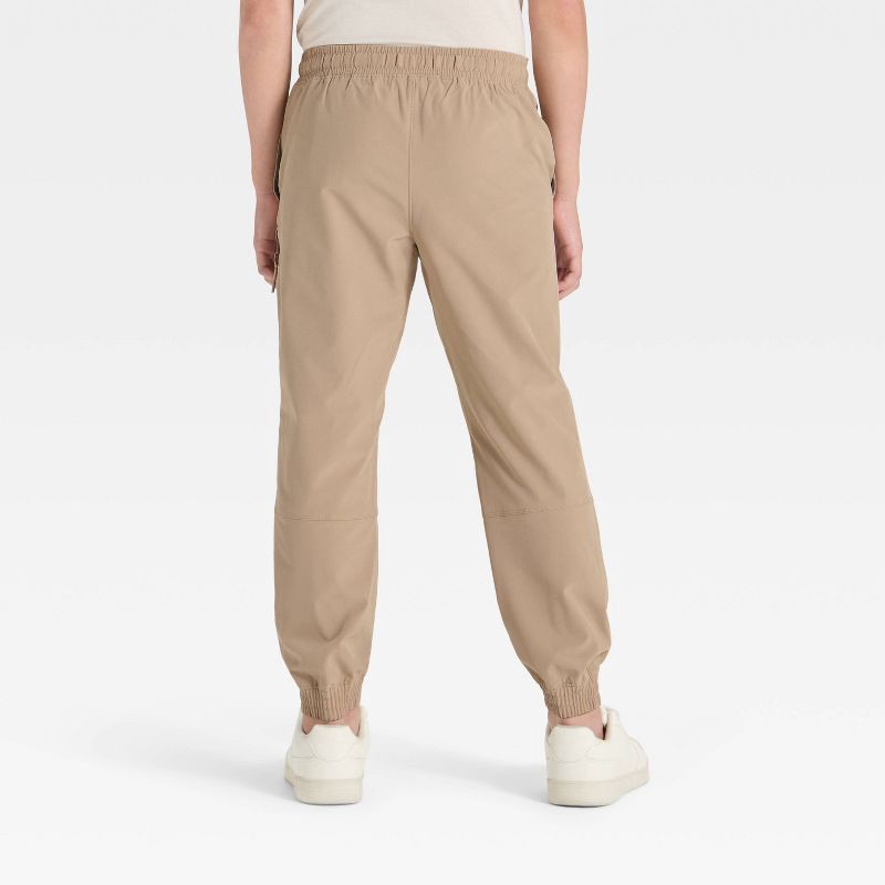 slide 2 of 3, Boys' Lined Woven Pants - All In Motion™ Tan M, 1 ct
