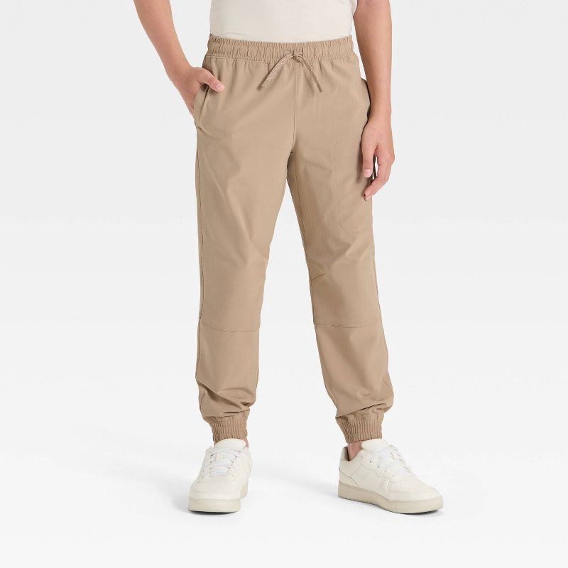 slide 1 of 3, Boys' Lined Woven Pants - All In Motion™ Tan M, 1 ct