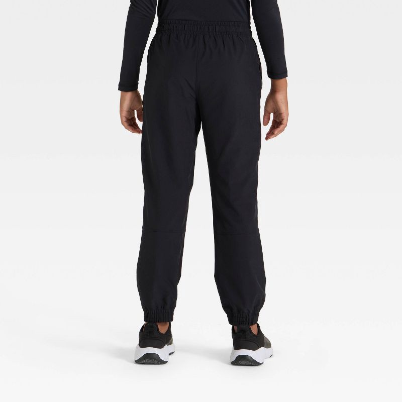slide 2 of 3, Boys' Lined Woven Pants - All In Motion™ Black M, 1 ct