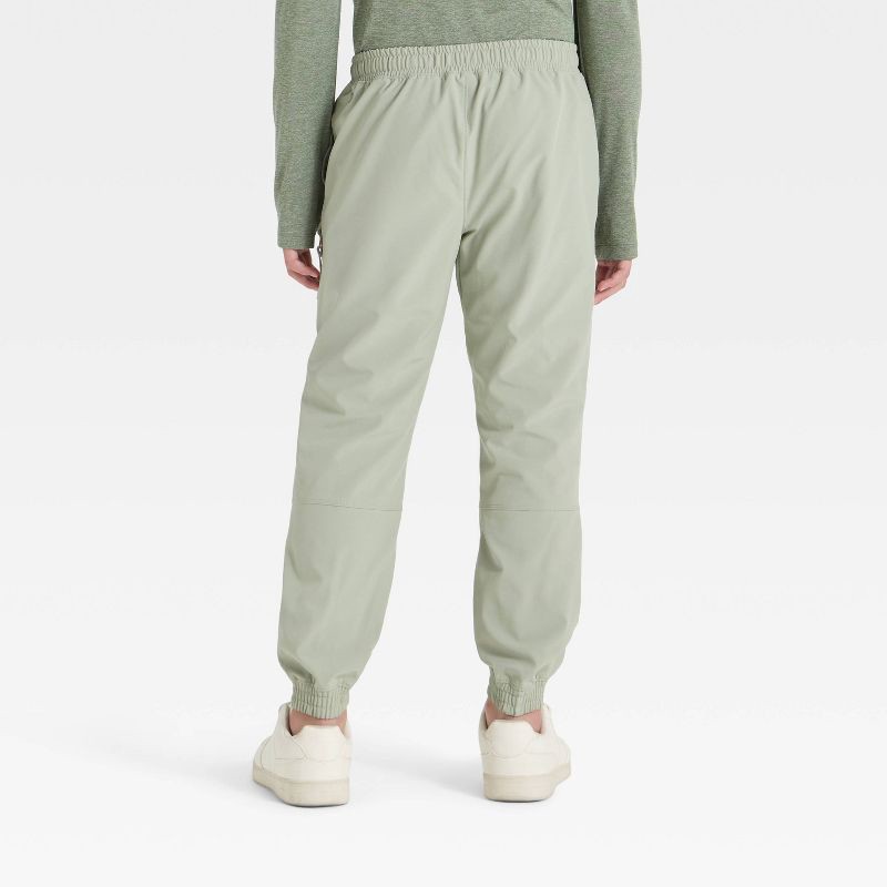 slide 2 of 3, Boys' Lined Woven Pants - All In Motion™ Light Green S, 1 ct