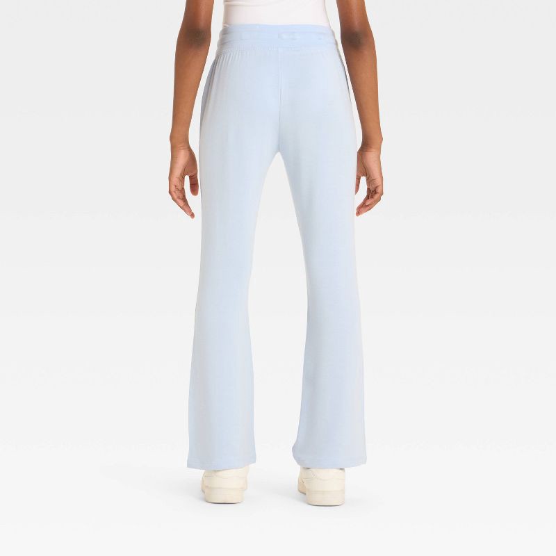 slide 2 of 3, Girls' Modal French Terry Flare Pants - All In Motion™ Sky Blue M, 1 ct