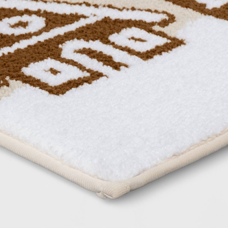 slide 3 of 4, 17"x24" Gingerbread House Christmas Bath Rug Brown/White - Wondershop™, 1 ct