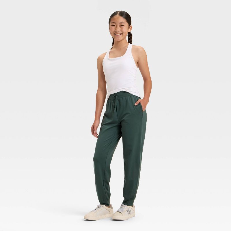 slide 3 of 3, Girls' Soft Stretch Jogger Pants - All In Motion™ Dark Green S, 1 ct