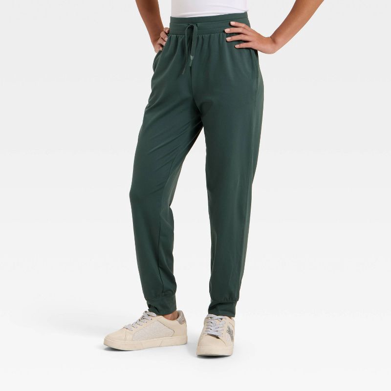 slide 1 of 3, Girls' Soft Stretch Jogger Pants - All In Motion™ Dark Green S, 1 ct