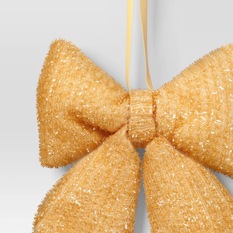slide 3 of 3, 6.5" Christmas Tinsel Bow Ornament Gold - Wondershop™, 1 ct