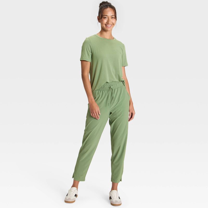 slide 5 of 5, Women's Crewneck Leggings Friendly Short Sleeve T-Shirt - All In Motion™ Olive Green M, 1 ct