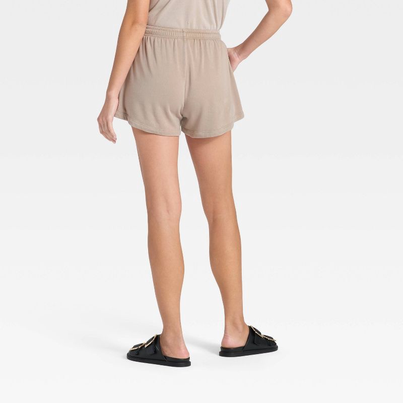 slide 2 of 3, Women's Mid-Rise Fleece Jogger Shorts - Universal Thread™ Tan S, 1 ct