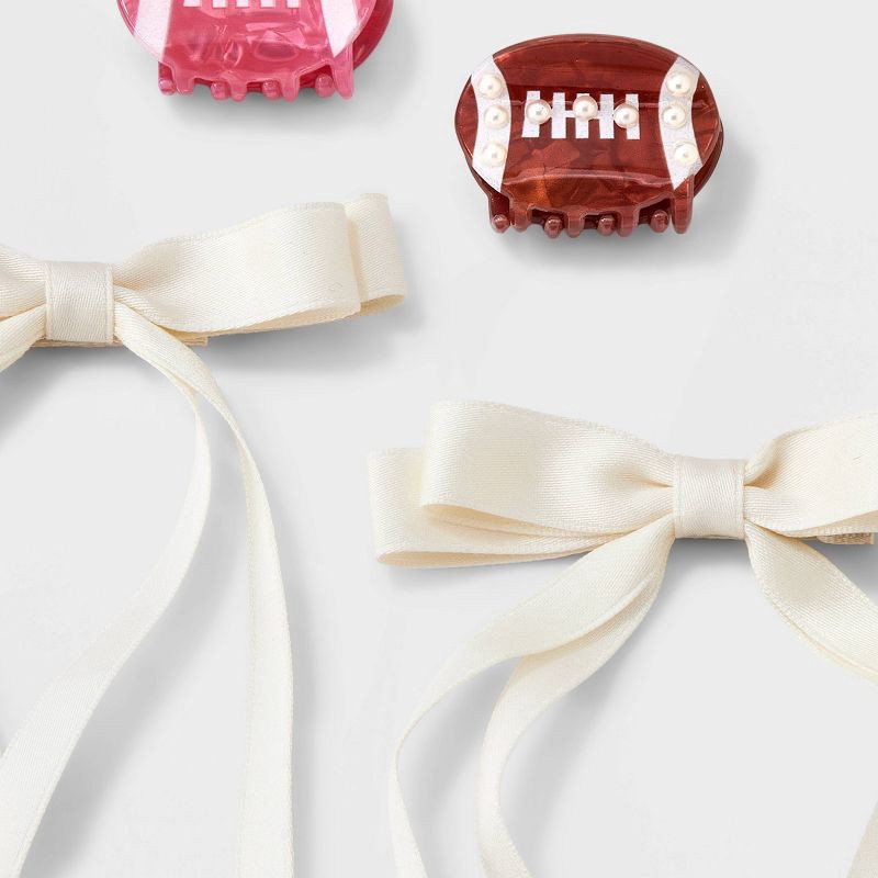 slide 3 of 3, Girls' 4pk Football and Satin Bow Claw Clip Set - art class™, 4 ct