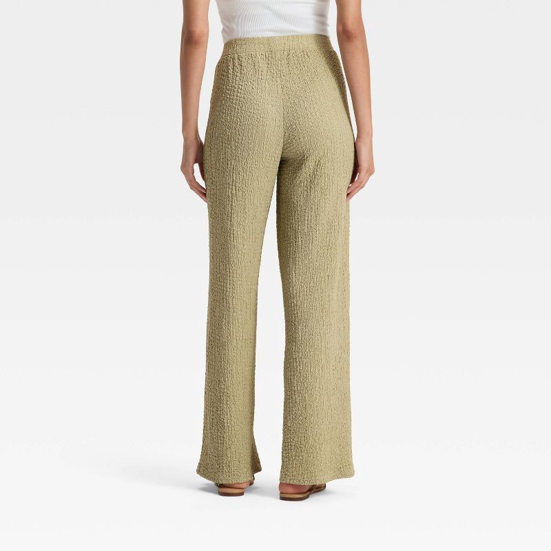 slide 2 of 3, Women's Mid-Rise Textured Pull-On Pants - A New Day™ Light Green S, 1 ct