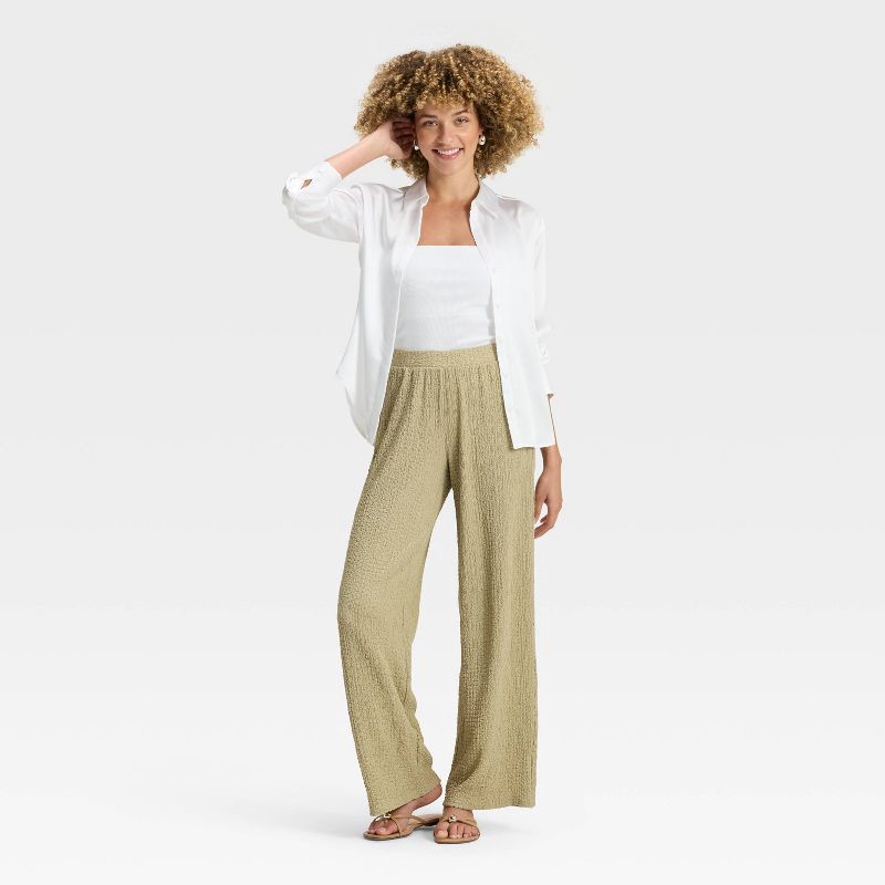 slide 3 of 3, Women's Mid-Rise Textured Pull-On Pants - A New Day™ Light Green S, 1 ct