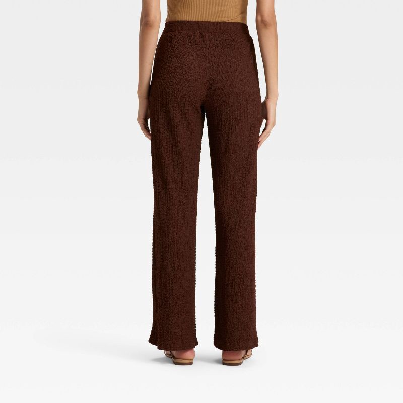 slide 2 of 3, Women's Mid-Rise Regular Fit Textured Pull-On Pants - A New Day™ Brown L, 1 ct