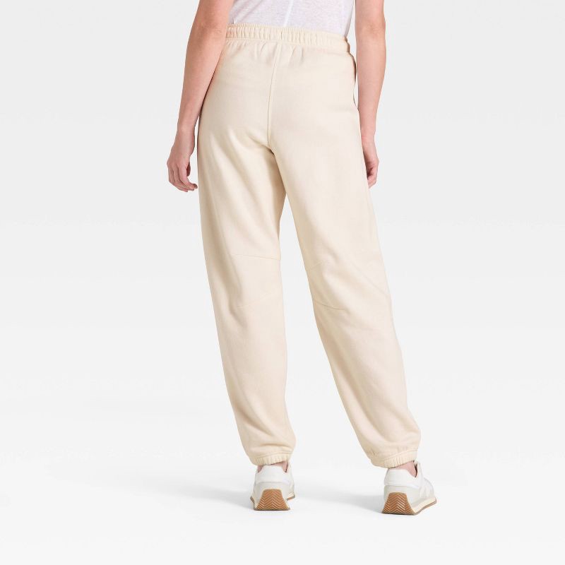slide 2 of 3, Women's Mid-Rise Barrel Leg Sweatpants - Universal Thread™ Cream XS, 1 ct