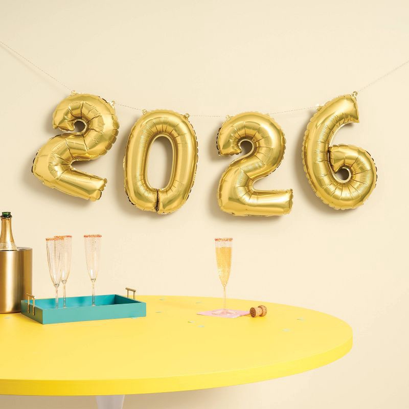 slide 2 of 4, New Year's Eve '2026' Gold Foil Balloon Banner - Spritz™, 1 ct