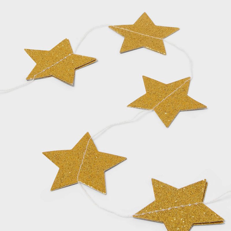 slide 3 of 4, New Year's Eve Gold Stars Paper Garland - Spritz™, 1 ct