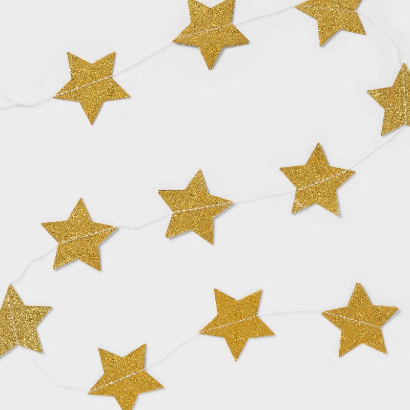 slide 1 of 4, New Year's Eve Gold Stars Paper Garland - Spritz™, 1 ct