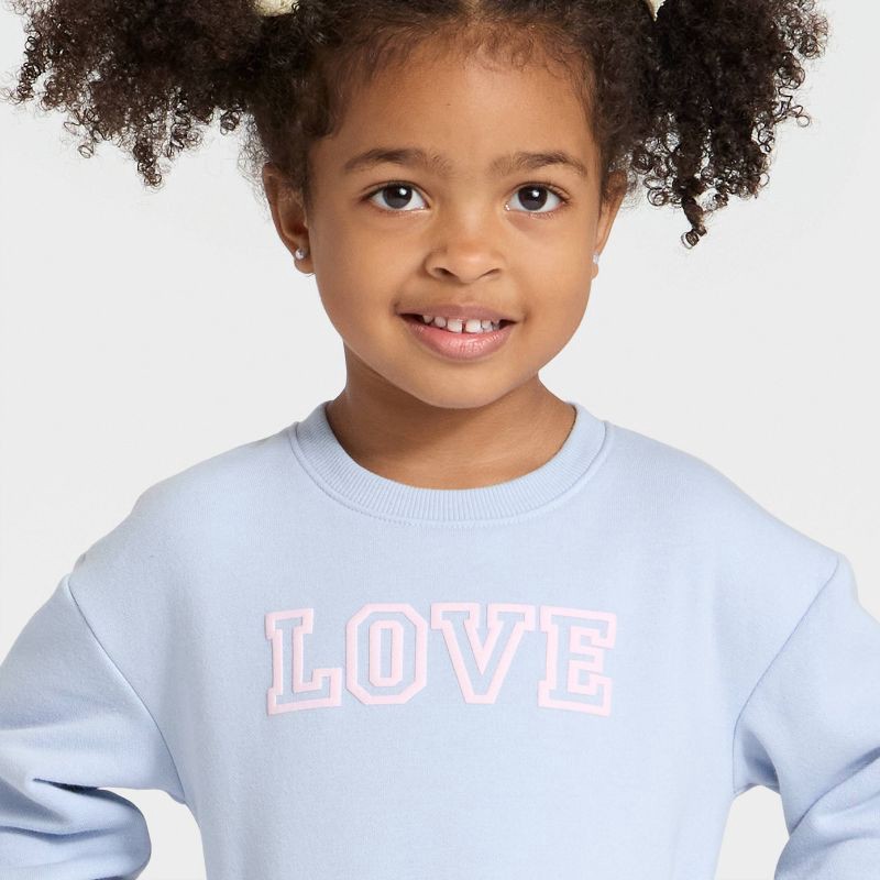 slide 2 of 4, Toddler Girls' 'Love' Fleece Pullover Sweatshirt - Cat & Jack™ Light Blue 4T, 1 ct