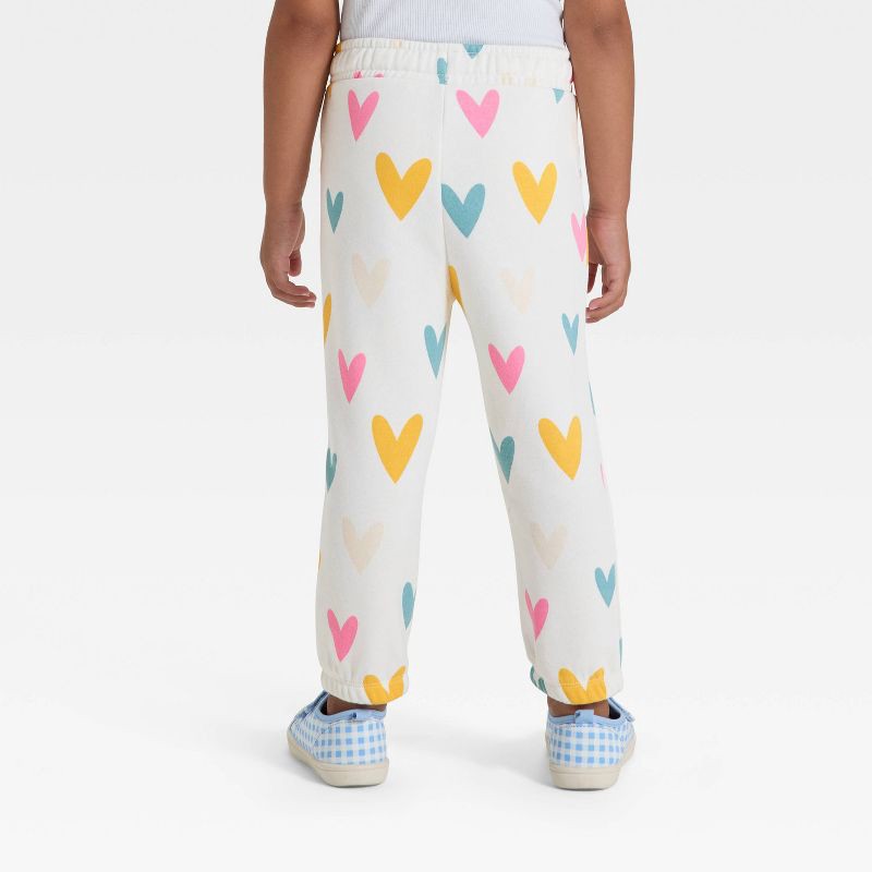slide 2 of 3, Toddler Girls' Hearts Fleece Jogger Pants - Cat & Jack™ Cream 12M, 1 ct