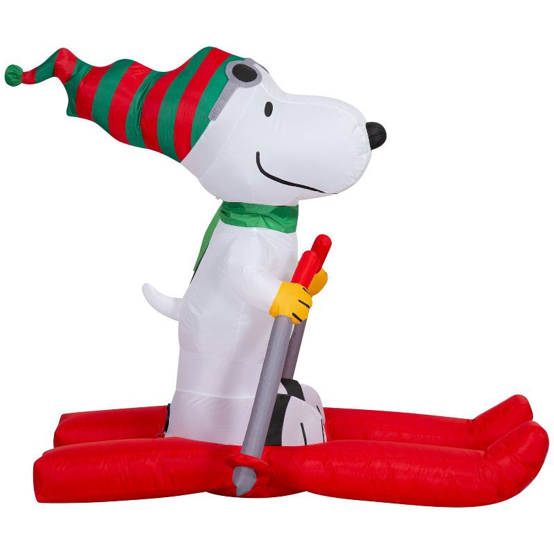 slide 2 of 4, 4.5' Peanuts Snoopy on Skis Christmas Indoor/Outdoor Lighted Inflatable, 1 ct