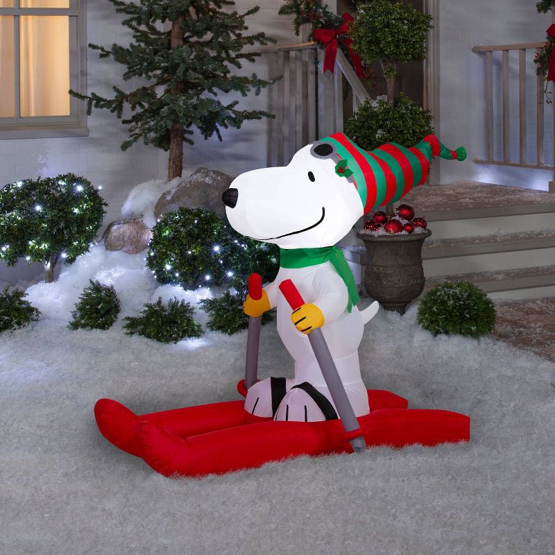 slide 4 of 4, 4.5' Peanuts Snoopy on Skis Christmas Indoor/Outdoor Lighted Inflatable, 1 ct