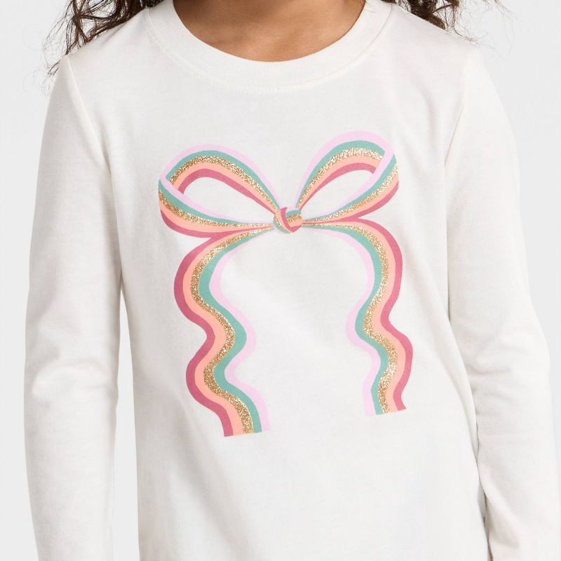 slide 2 of 4, Toddler Girls' Long Sleeve Rainbow Bow Graphic Shirt - Cat & Jack™ Cream 18M, 1 ct